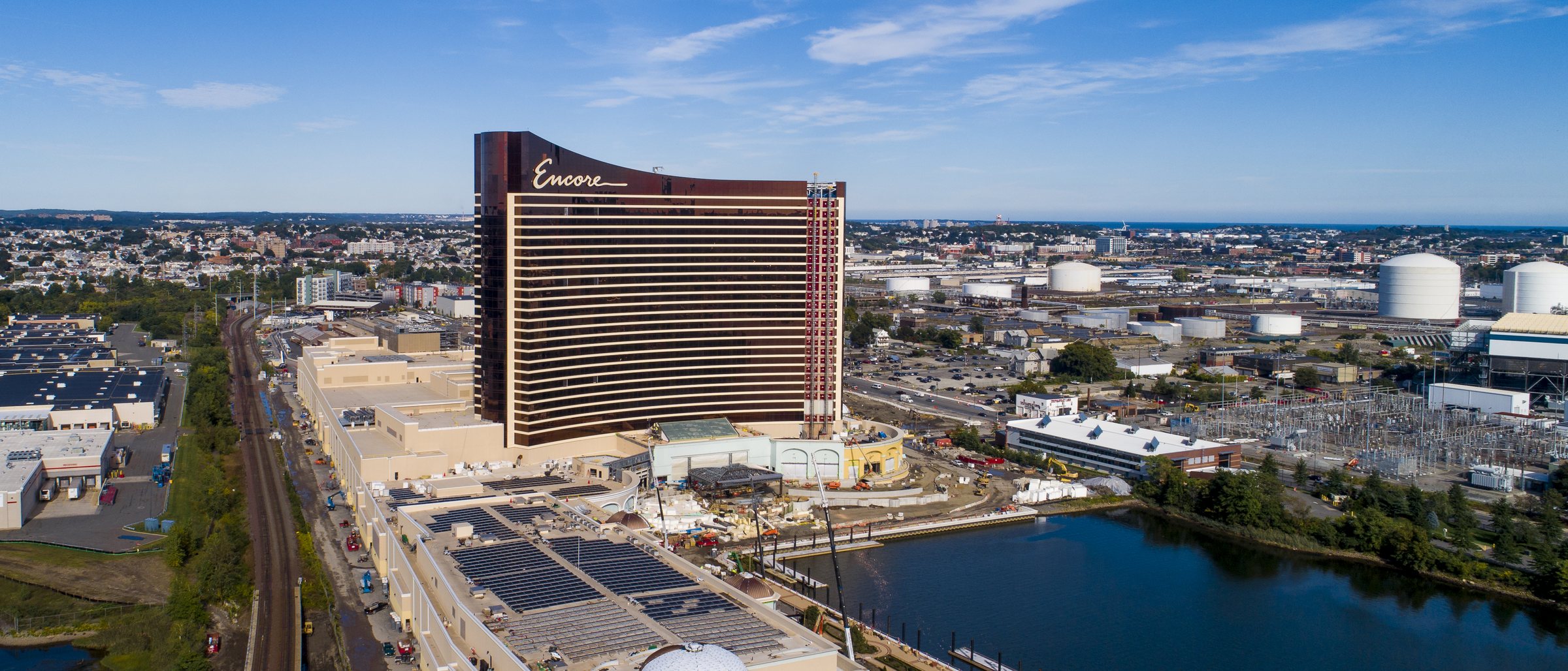 Encore Boston Harbor rising over the tank farms and Lower Broadway in Everett, Massachusetts, seen from the air in 2018.